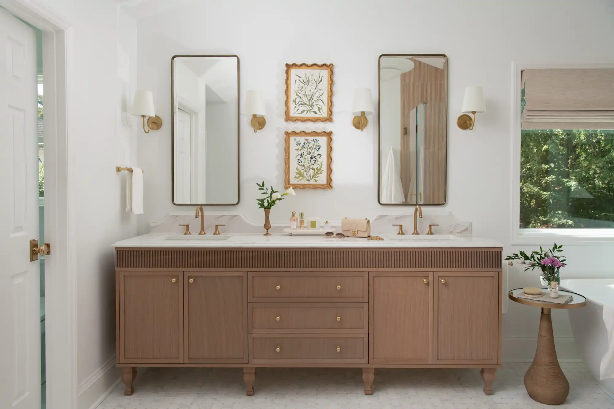 Luxurious bathroom vanity with dual mirrors and brass fixtures