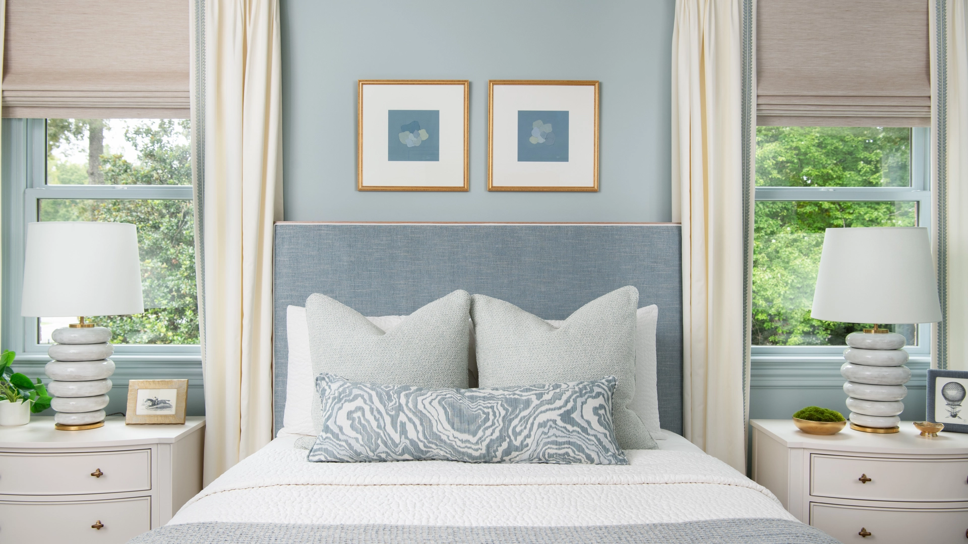 Serene blue bedroom with upholstered headboard