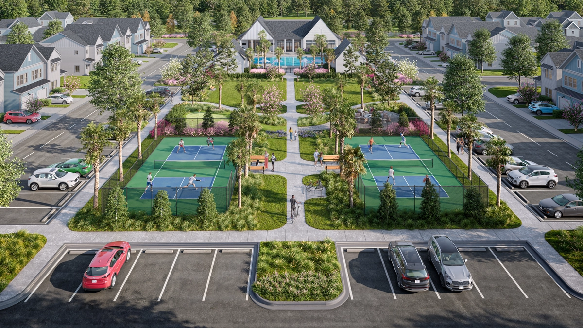 Aerial rendering of the community with two pickleball courts, walking paths, palm trees, and white cottage-style homes surrounding a central green space