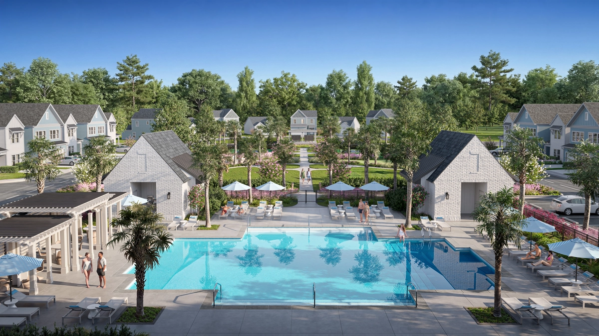 Aerial rendering of the community pool area surrounded by white cottage-style homes, umbrellas, lounge seating, and lush landscaping